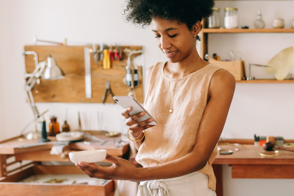 A brand owner takes a photograph of her product 