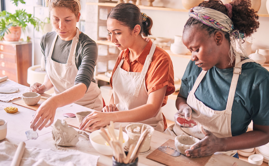 A pottery class takes place inside of a retail store